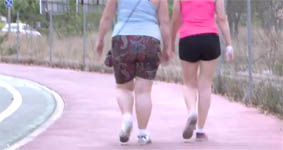 Two women are practising sport.